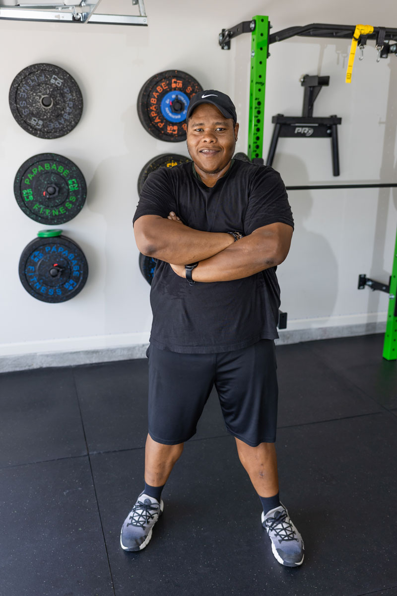 Male coach is posing.