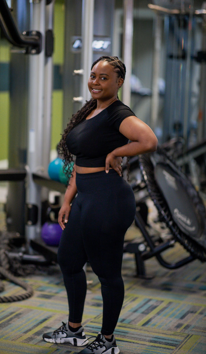 Female coach is posing.